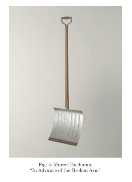 Marcel Duchamp’s artwork In Advance of the Broken Arm. It is a plain snow shovel with a long wooden handle and a wide silver metal scoop. The shovel hangs vertically against a neutral background.